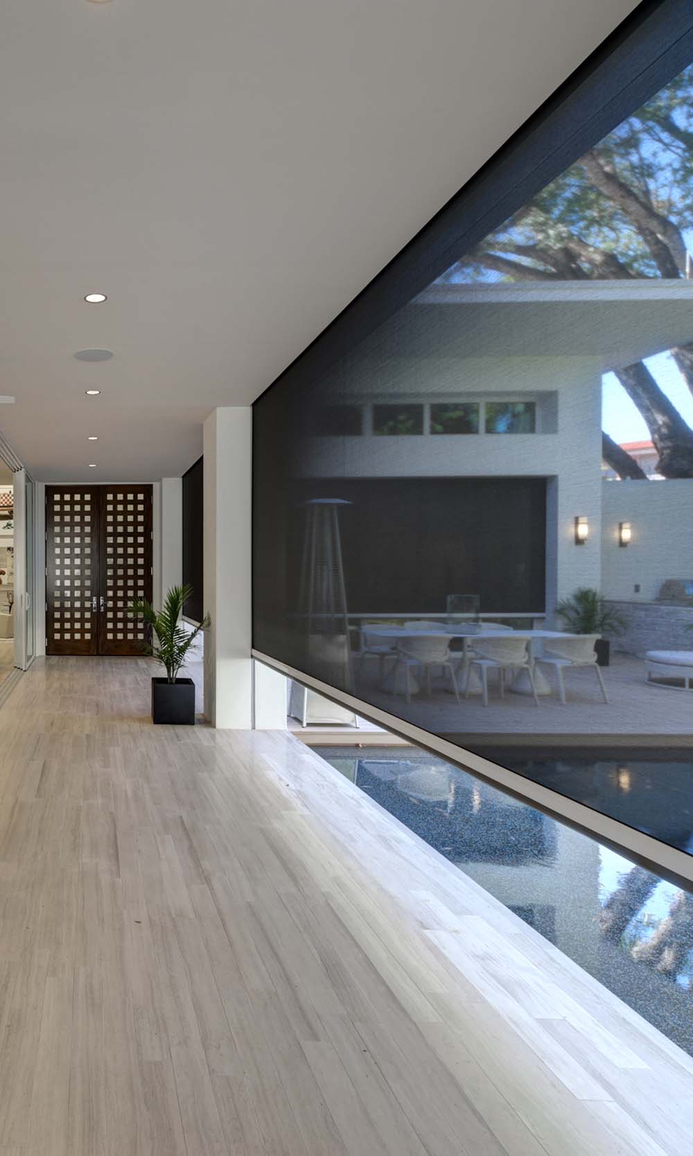 oversized screen technology with warm wood accents