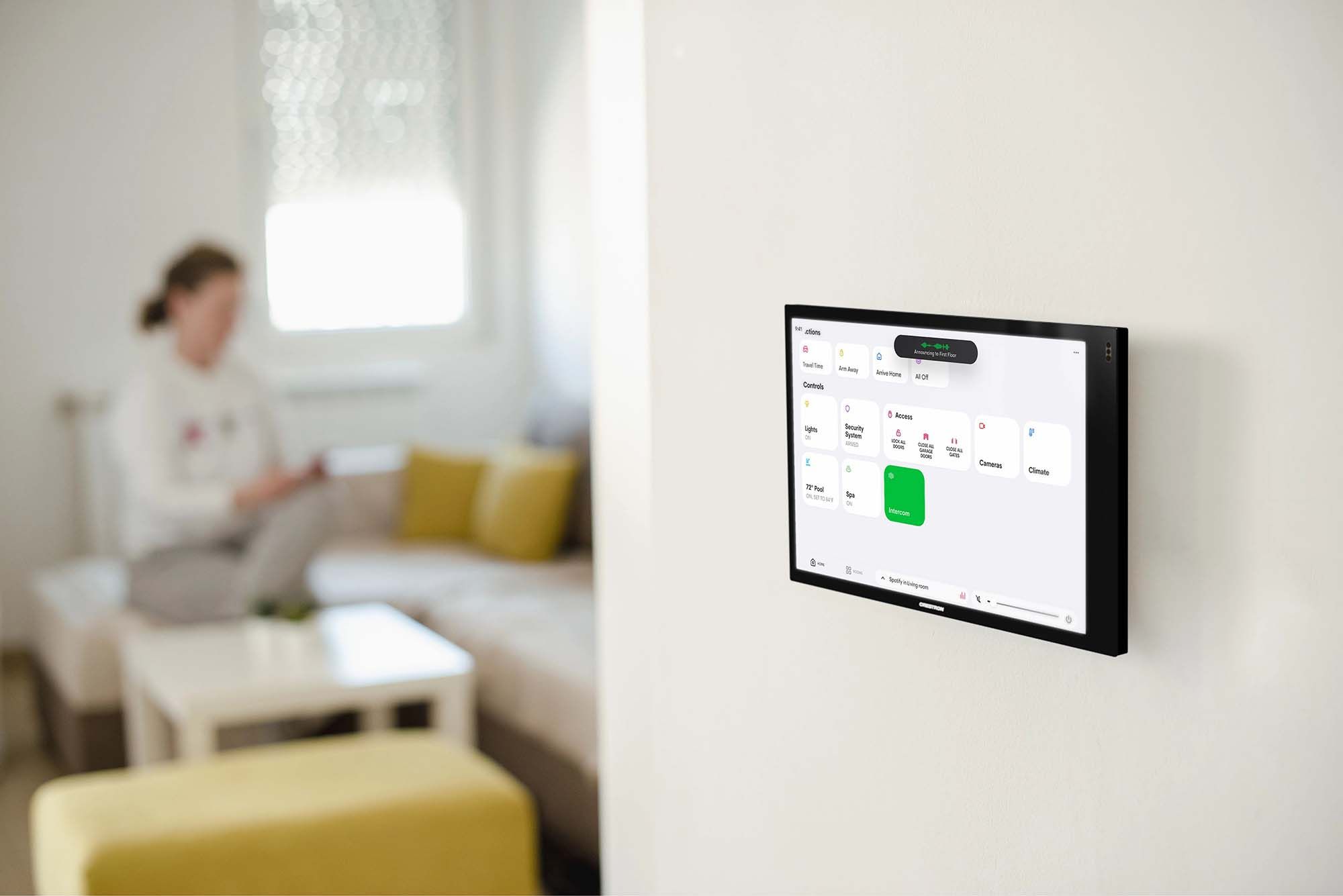 crestron control panel on the wall of a home
